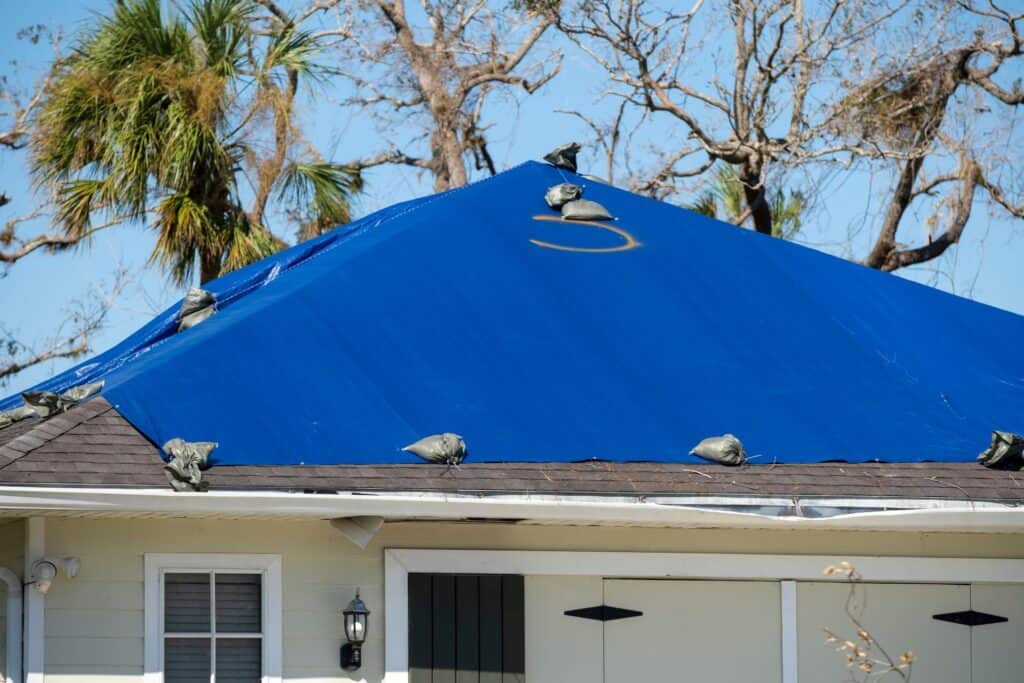 Damaged Roof With Tarp